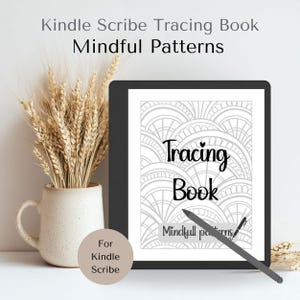 May include: A Kindle Scribe tracing book with the words "Tracing Book" and "Mindful Patterns" on the screen. A stylus rests on the screen. A beige ceramic vase with wheat stalks is to the left. A small, round, beige sticker says "For Kindle Scribe".
