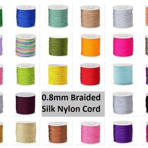 May include: Assortment of 0.8mm braided silk nylon cord spools in various colors, including green, blue, teal, beige, gray, orange, purple, pink, yellow, red, brown, and white.