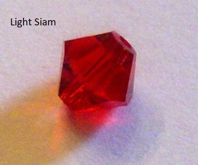 Clearance 6mm Swarovski beads Light Siam red crystal bicones 24 pieces Bild 1