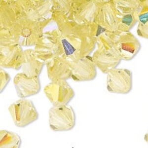 Preciosa Czech bicone crystal beads faceted Jonquil AB (pale yellow) -- available in 3mm 4mm 5mm and 6mm