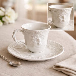 May include: A set of three ceramic mugs with a speckled, matte finish. The mugs are in shades of cream, light gray, and dark gray. Each mug has a simple, minimalist design, perfect for coffee or tea.