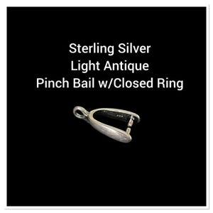 May include: A sterling silver pinch bail with a closed ring, light antique finish. The text in the image reads "Sterling Silver Light Antique Pinch Bail w/Closed Ring". The bail is a jewelry component used for attaching pendants to chains.
