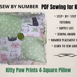 May include: A green and pink pillow with a kitty paw print design. The pillow is made up of four squares, each with a different kitty paw print design. The pillow is labeled "Kitty Paw Prints 4-Square Pillow".