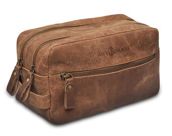 May include: A brown leather travel bag with a zippered pocket and the text "Jack & Shaver" embossed on the front.