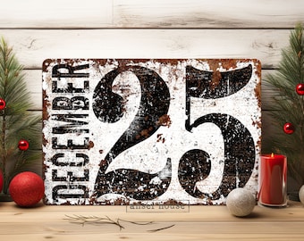 May include: A white metal sign with black text and numbers. The sign reads "December 25" with a distressed, rusty look.