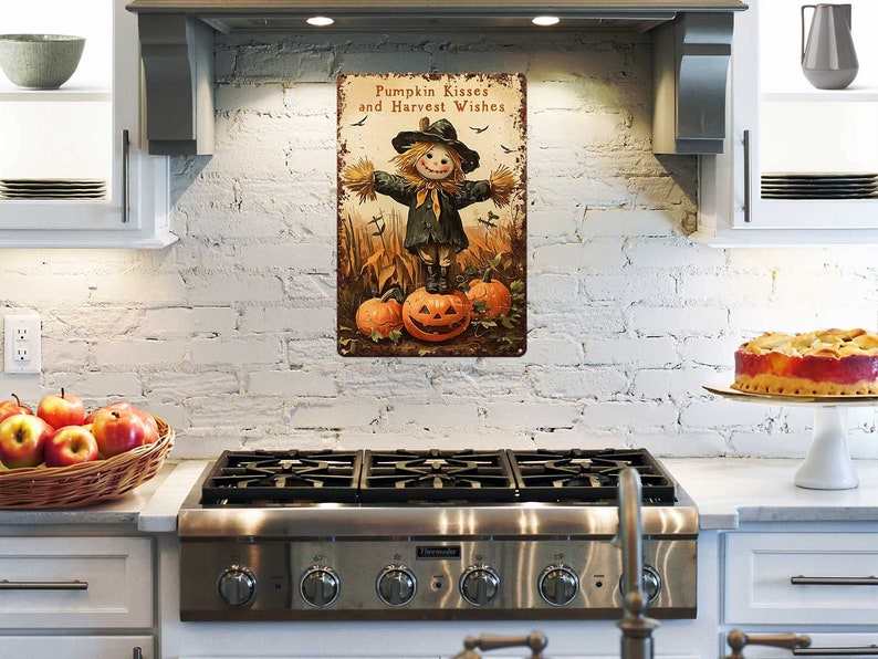 May include: A rectangular metal sign with a rustic design. The sign features a scarecrow standing on a carved pumpkin, with the text "Pumpkin Kisses and Harvest Wishes". The color palette includes orange, brown, and black.