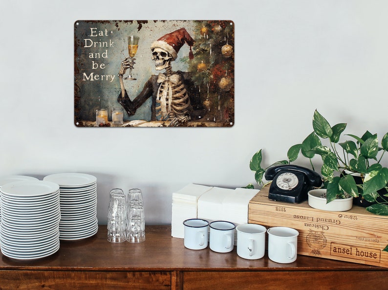 May include: A metal sign with a distressed, rusty look featuring a skeleton wearing a Santa hat and holding a glass of champagne. The sign reads "Eat, Drink and be Merry".
