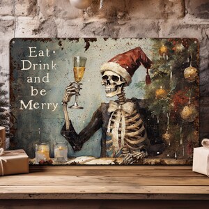 May include: A metal sign with a rusty, distressed look featuring a skeleton wearing a Santa hat and holding a glass of wine. The sign says "Eat, Drink and be Merry".