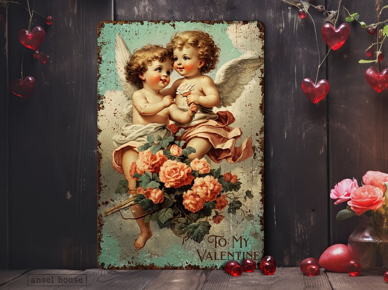 May include: Vintage Valentine's Day metal sign featuring two cherubs with wings, holding a flower and surrounded by pink roses. The sign has a distressed, rusty look and reads "To My Valentine".
