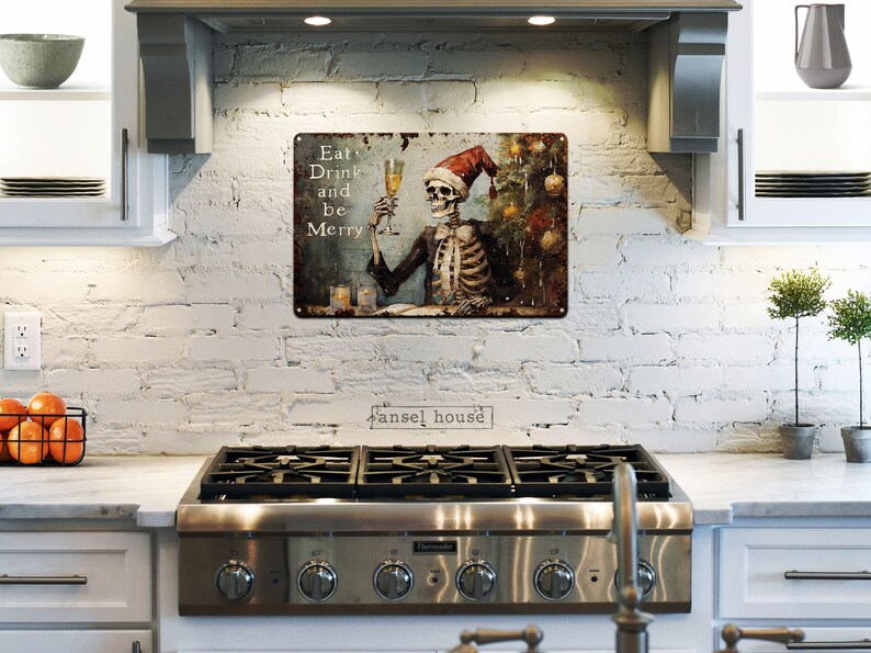 May include: A metal sign with a skeleton wearing a Santa hat and holding a glass of champagne. The sign says "Eat Drink and Be Merry".