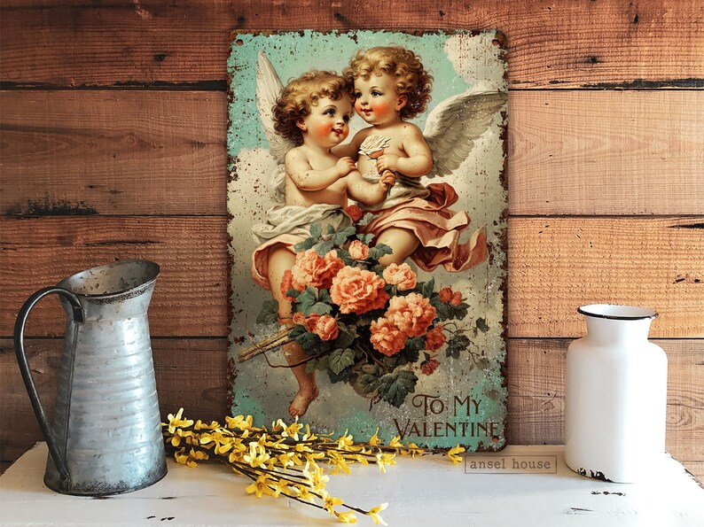 May include: Vintage-style metal sign featuring two cherubs with wings, holding a bouquet of pink roses. The sign has a distressed, rustic look and reads "To My Valentine" at the bottom.