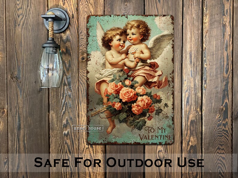 May include: Vintage-style metal sign featuring two cherubs with wings, holding a bouquet of pink roses. The sign has a distressed, aged look and reads "To My Valentine".