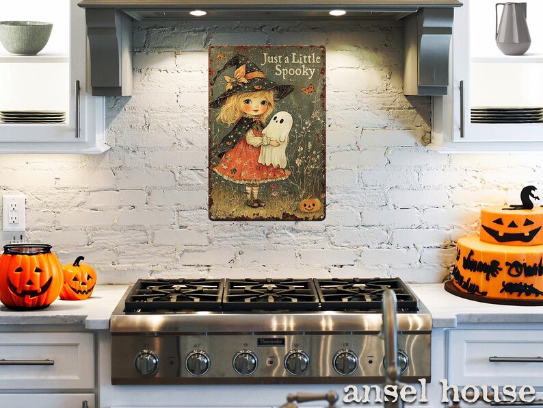 May include: A vintage-style metal sign featuring a young girl dressed as a witch holding a ghost, with the text "Just a Little Spooky." The sign has a distressed finish and is mounted on a white brick wall.