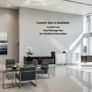 Pu&ograve; includere: Interno di una moderna hall con reception, area salotto e ampie finestre. Il testo sulla parete recita: "Custom Size is Available Contact via Etsy Message Box for Detailed Information."