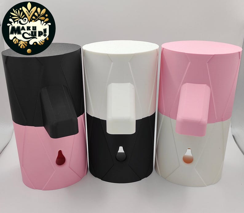 May include: Three silicone soap dispensers with a two-tone design. The dispensers are black and pink, white and black, and pink and white.