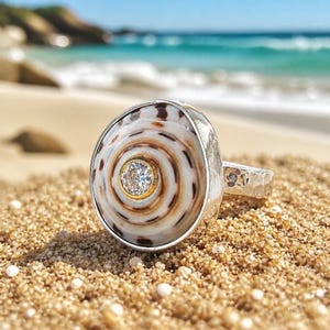 Hebrew Cone Shell ring with inset CZ and sterling silver hand hammered band