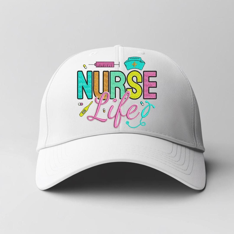 May include: A white baseball cap featuring the embroidered text "NURSE Life". The design incorporates a syringe, a nurse's hat, a thermometer, and a stethoscope in various bright colours. A cap for nurses.