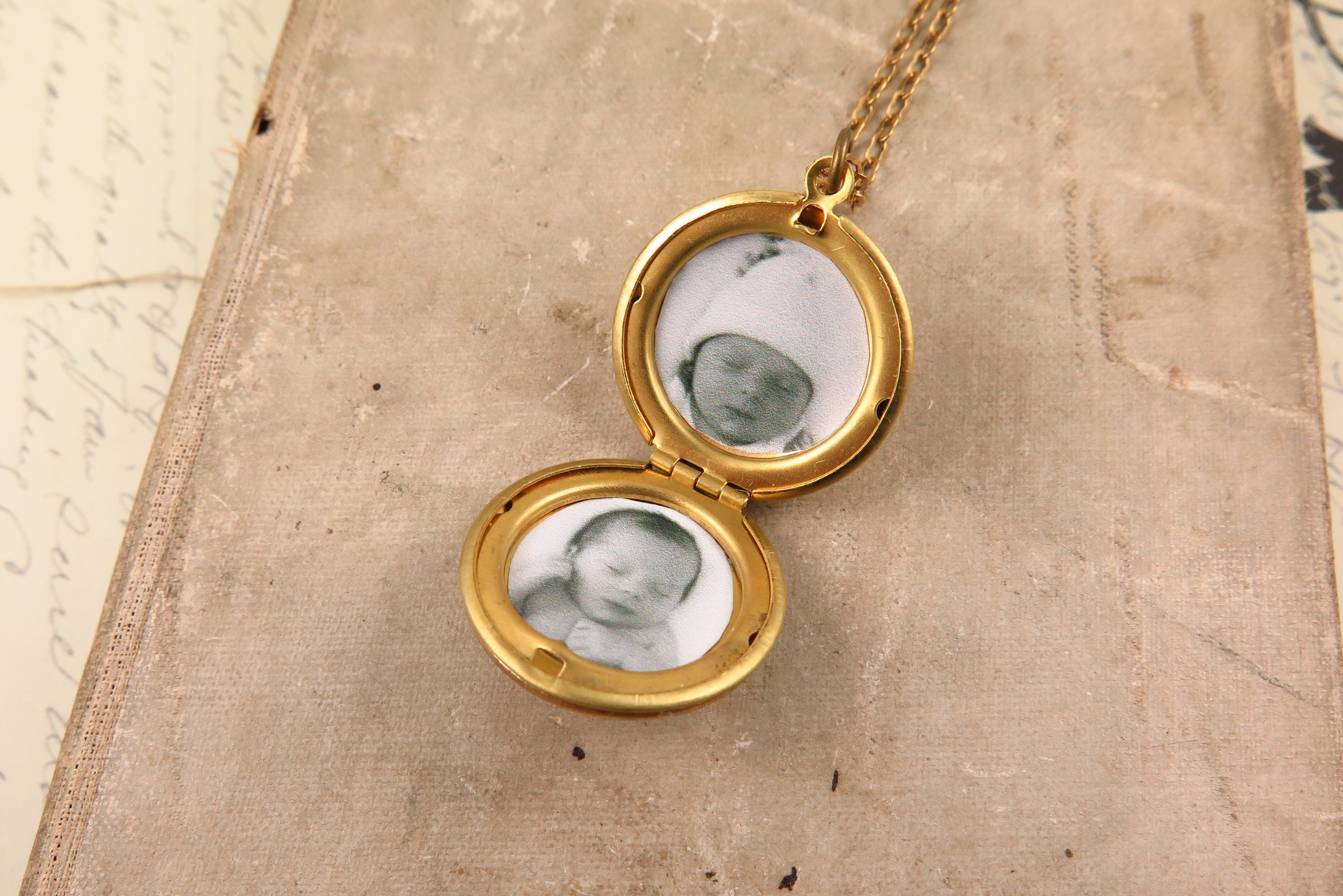 Photo Service installation photos in a locket pendant