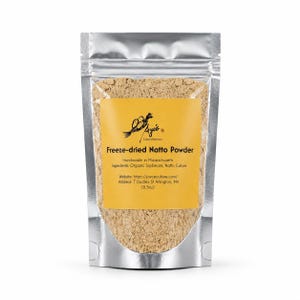 May include: A silver stand-up pouch containing beige freeze-dried Natto powder. The yellow label features the text: Ayi's Cultured Kitchens, Freeze-dried Natto Powder, Handmade in Massachusetts, Ingredients: Organic Soybeans, Natto Culture, 0.5oz.