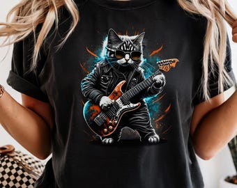 May include: Black t-shirt featuring a graphic of a cat wearing sunglasses and a leather jacket, playing an electric guitar. The cat is depicted with a rock and roll aesthetic, surrounded by blue and orange energy bursts.
