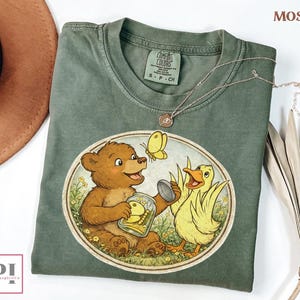 vintage storybook bear and duck graphic tee cozy animals