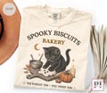 Spooky Biscuits Bakery Comfort Colors Shirt, Black Cat Halloween Shirt, Funny Baking Cat Tee, Ghost Biscuit Shirt product logo