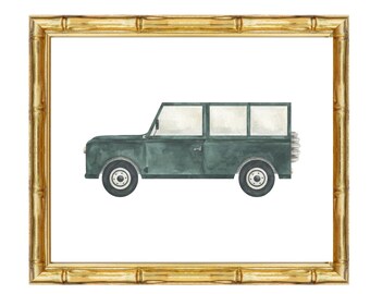 May include: Watercolor painting of a dark teal SUV inside a gold bamboo-style frame. The vehicle has white windows and black tires. The frame is rectangular with a natural wood grain finish. The artwork is on a white background.