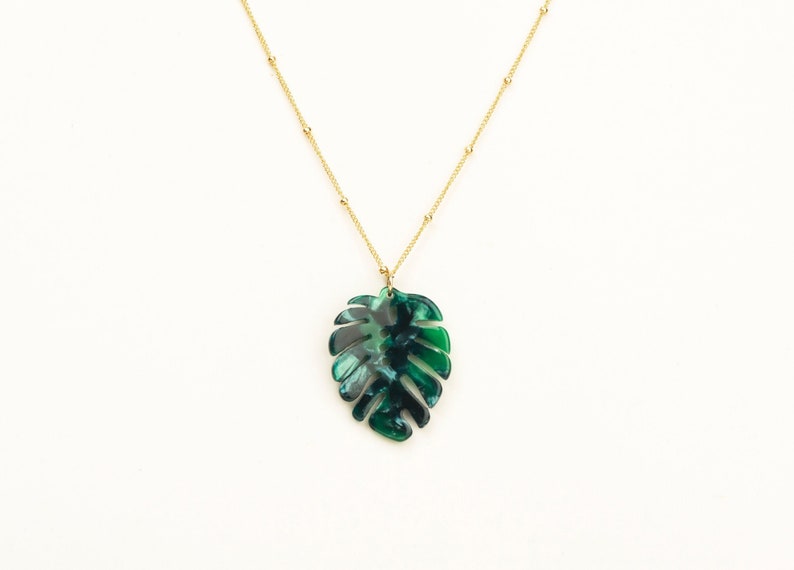 Bright green monstera leaf with stunning detail placed on a high-end satellite chain in 14kt gold or rose fill or sterling silver.  Perfect plant lover gift!