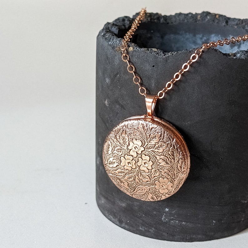 Small rose gold photo locket and small etched flower pattern.  14kt rose filled chain, long, medium or short length. Great for kids and teenagers!