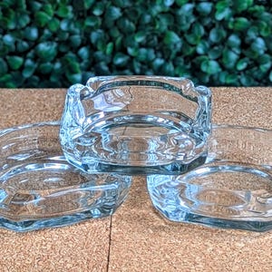 May include: A handmade wooden sign with the text "Welcome to our home" in a handwritten style. The sign is painted white with a distressed finish and a dark brown border. It is designed for indoor or outdoor use.