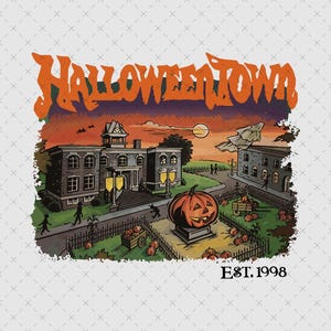 May include: A graphic print featuring the text HALLOWEENTOWN in orange stylized lettering above a scene of a town square with a large jack-o'-lantern, buildings, and silhouettes of figures. The text EST. 1998 is printed in black at the bottom right.