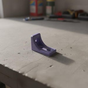 May include: A small, light purple L-shaped bracket featuring a curved support brace and two circular mounting holes. The bracket has a smooth, matte finish and is positioned to show its profile, including one hole on the vertical side and one on the base.