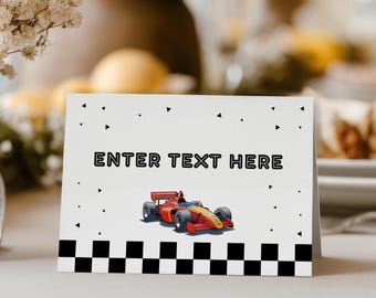 Könnte beinhalten: Eine weiße Klappkarte mit dem Text ENTER TEXT HERE in schwarzen Blockbuchstaben, einer kleinen roten Rennwagen-Illustration und einem schwarz-weißen Karomuster am unteren Rand, akzentuiert durch verstreute schwarze Dreiecke.