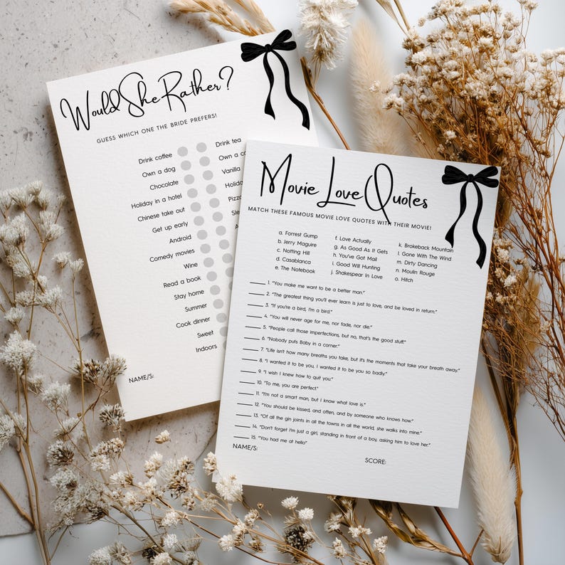 May include: Two white paper game cards with black text and a black bow illustration. One card is titled Would She Rather? and the other is titled Movie Love Quotes. Both cards feature lists of questions and lines for names and scores in black ink.