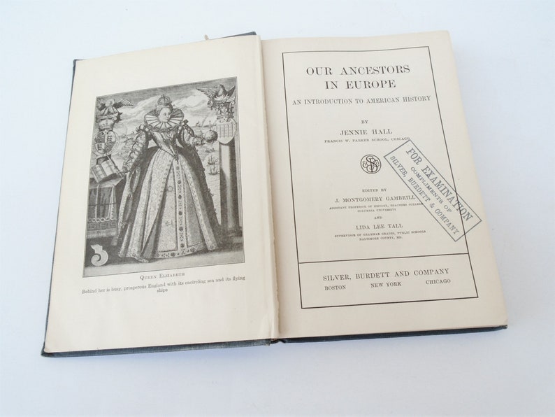 May include: An open book titled "Our Ancestors in Europe: An Introduction to American History" by Jennie Hall. The book is published by Silver, Burdett and Company. The cover features a black and white illustration of Queen Elizabeth I.