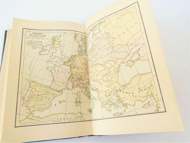 May include: A vintage map of Europe from the middle of the 18th century. The map shows the boundaries of various countries, including England, France, Spain, Germany, and Russia. The map is printed on a cream-colored paper with brown lines and text.