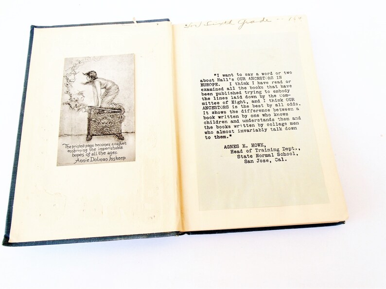 May include: An open book with a black and white illustration of a person standing on a box. The book is titled "Our Ancestors in Europe" and includes a quote from Agnes E. Howe, Head of Training Dept., State Normal School, San Jose, Cal.