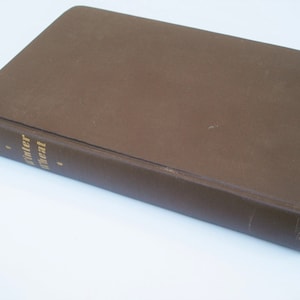 May include: A brown hardcover book with the title "Winter Wheat" and the author "Mildred Walker" printed in gold lettering on the spine.