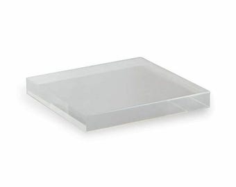 May include: A clear acrylic square display stand. The stand is made of thick, durable acrylic and is perfect for displaying small items.