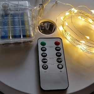 Un jeu de guirlandes lumineuses LED à piles sur mesure avec télécommande