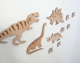 May include: Wooden dinosaur wall decor set featuring a Tyrannosaurus Rex, Stegosaurus, Triceratops, and a Brachiosaurus, along with several dinosaur footprints.