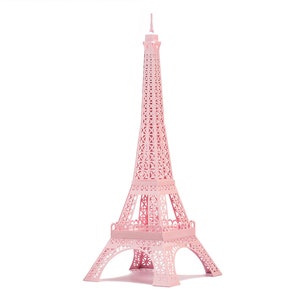 Pink-colored 3d paper scale model of the Eiffel Tower, made out of pre-cut paper parts.