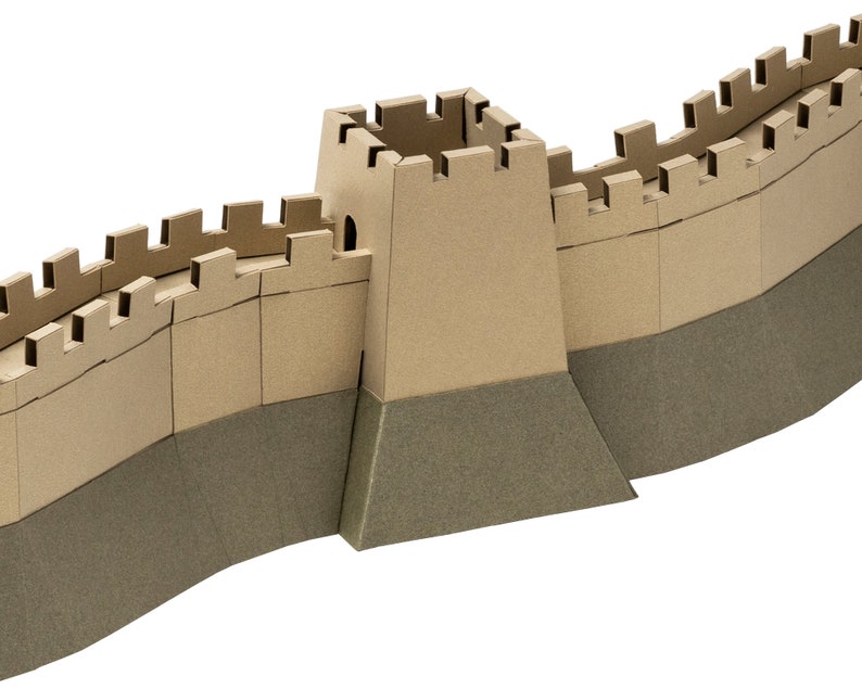 Closeup of the assembled 3d paper model of the Great Wall of China. The view fetures a tower and two wall segments with crenellation.