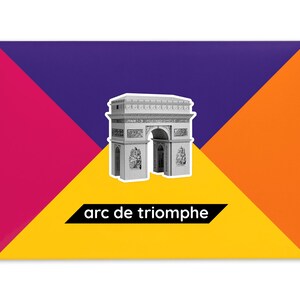 Product packaging for the Arc de Triomphe paper model kit. The bright coloured cardstock envelope features four large triangles in yellow, magenta, purple and orange with an image of a finished model at the centre and the product title below.