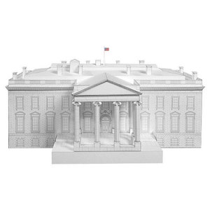 Assembled a 3D paper scale model of the White House. The model is constructed from white cardstock with black printed facade details. The frontal view features the North Portico with four columns.