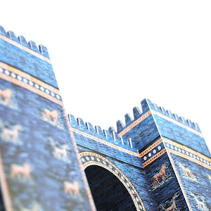 Closeup of the scale model of the Great Gate of Ishtar featuring two towers and the entrance arch between them. The model is made out of full-colour printed paper parts to replicate blue glazed brick walls decorated with golden stripes and animals.