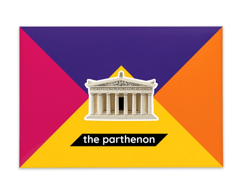 Product packaging for the Parthenon paper model kit. A rectangular bright coloured cardstock envelope features four large triangles in yellow, magenta, purple and orange with an image of a finished model at the centre and the product title below.
