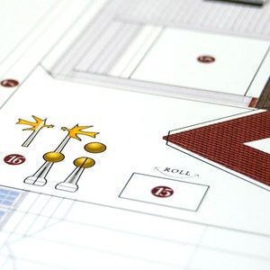 Closeup of the worksheet with printed paper parts to be cut out and assembled in order to make a scale model of the Mount Vernon mansion.