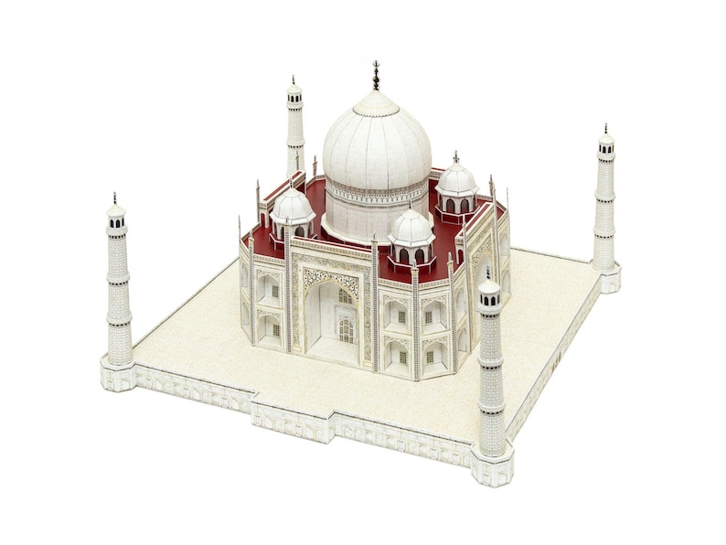The exterior overview of the 3D paper model of Taj Mahal shows its central dome, four kiosk domes, and four minarets which are aligned on a base.