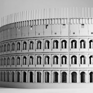 Assembled 3d scale model of the Roman Colosseum. The model of the ancient oval amphitheatre is made out of printed paper parts, the graphics feature external wall colonades and corridors.